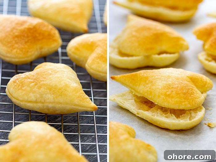 Flaky Puff Pastry Hearts for Valentine’s Day Gifts 4 Heart-shaped puff pastries, golden-brown, cooling on a rack and baking sheet.