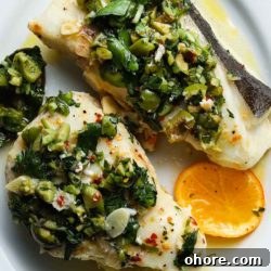 Halibut en Papillote with Green Olive Salsa Verde: Citrus Herb Bake 6 Halibut with green olive salsa verde and a slice of citrus.