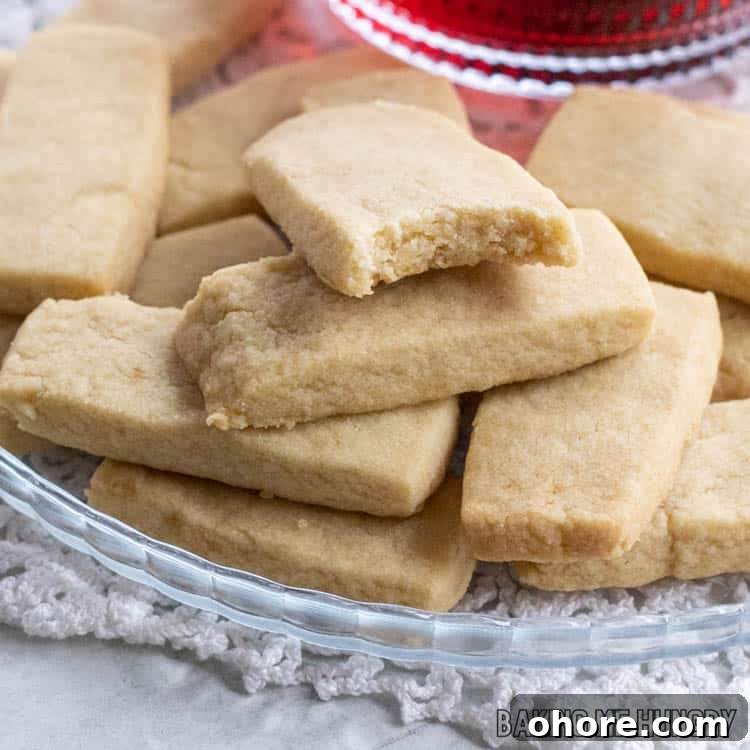 3-Ingredient Brown Sugar Cookies Recipe 12 cookie with a bite missing next to a cup of tea