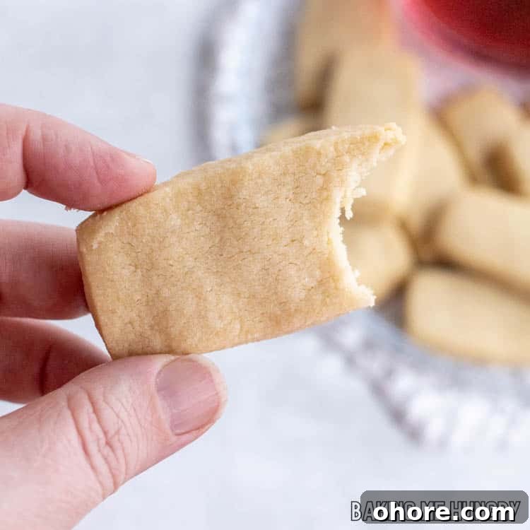 3-Ingredient Brown Sugar Cookies Recipe 13 hand holding a brown sugar cookie missing a bite