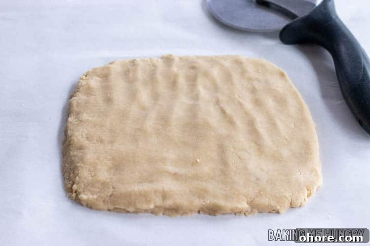 3-Ingredient Brown Sugar Cookies Recipe 7 a rectangle of dough next to a pizza cutter
