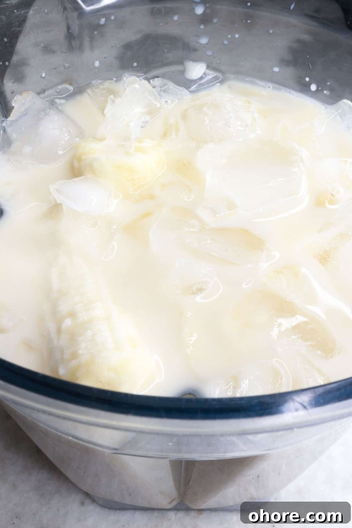 Banana Agua Fresca Recipe — Refreshing Banana Water Drink 5 blender with bananas, ice, milk and water
