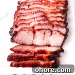 Char Siu Chinese BBQ Pork Recipe: Authentic Cantonese Roast Pork 17 Sliced char siu on a plate.