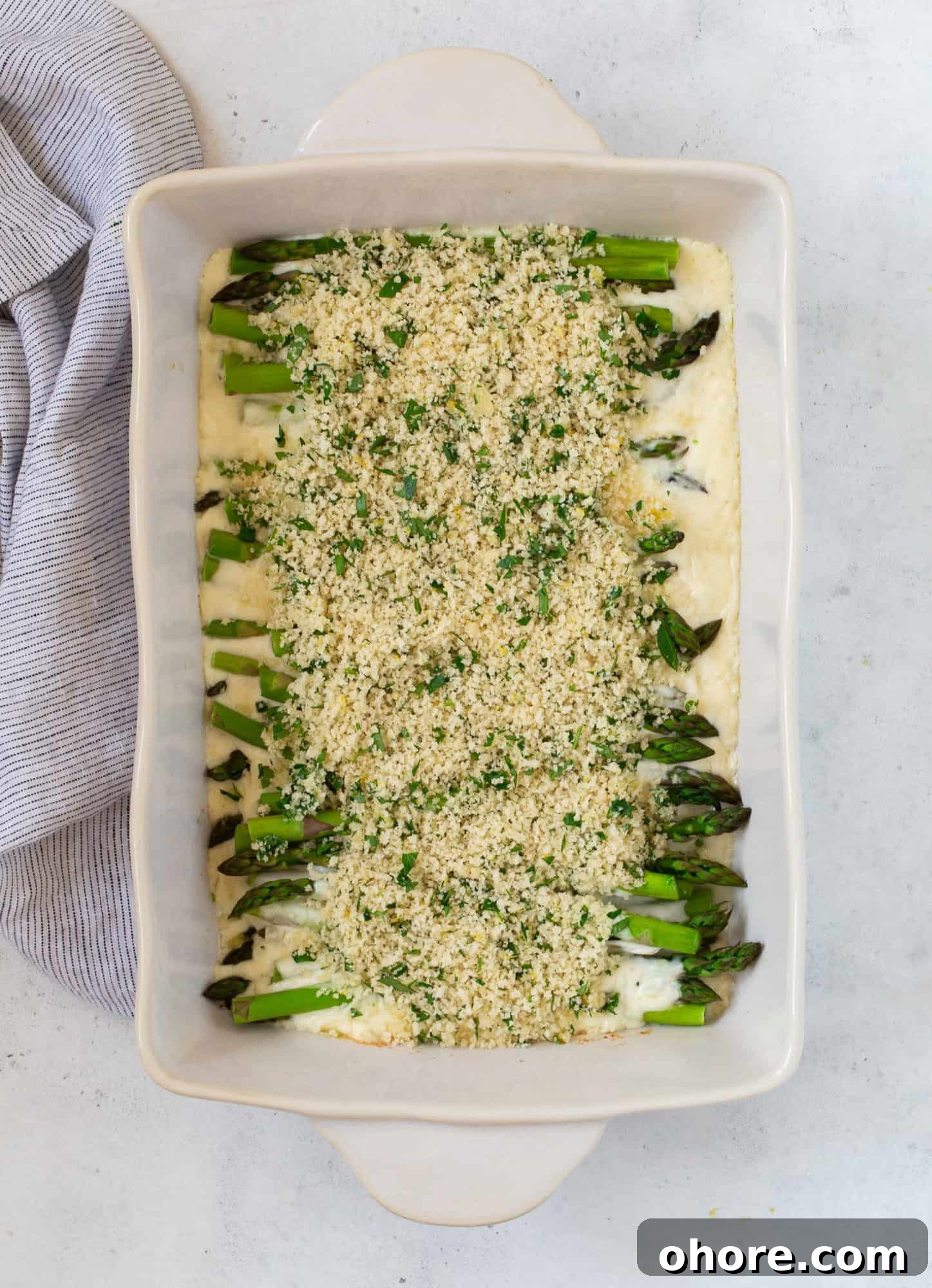 Creamy Asparagus Casserole Recipe for Spring Dinner 15 Breadcrumbs added to casserole, not yet baked.