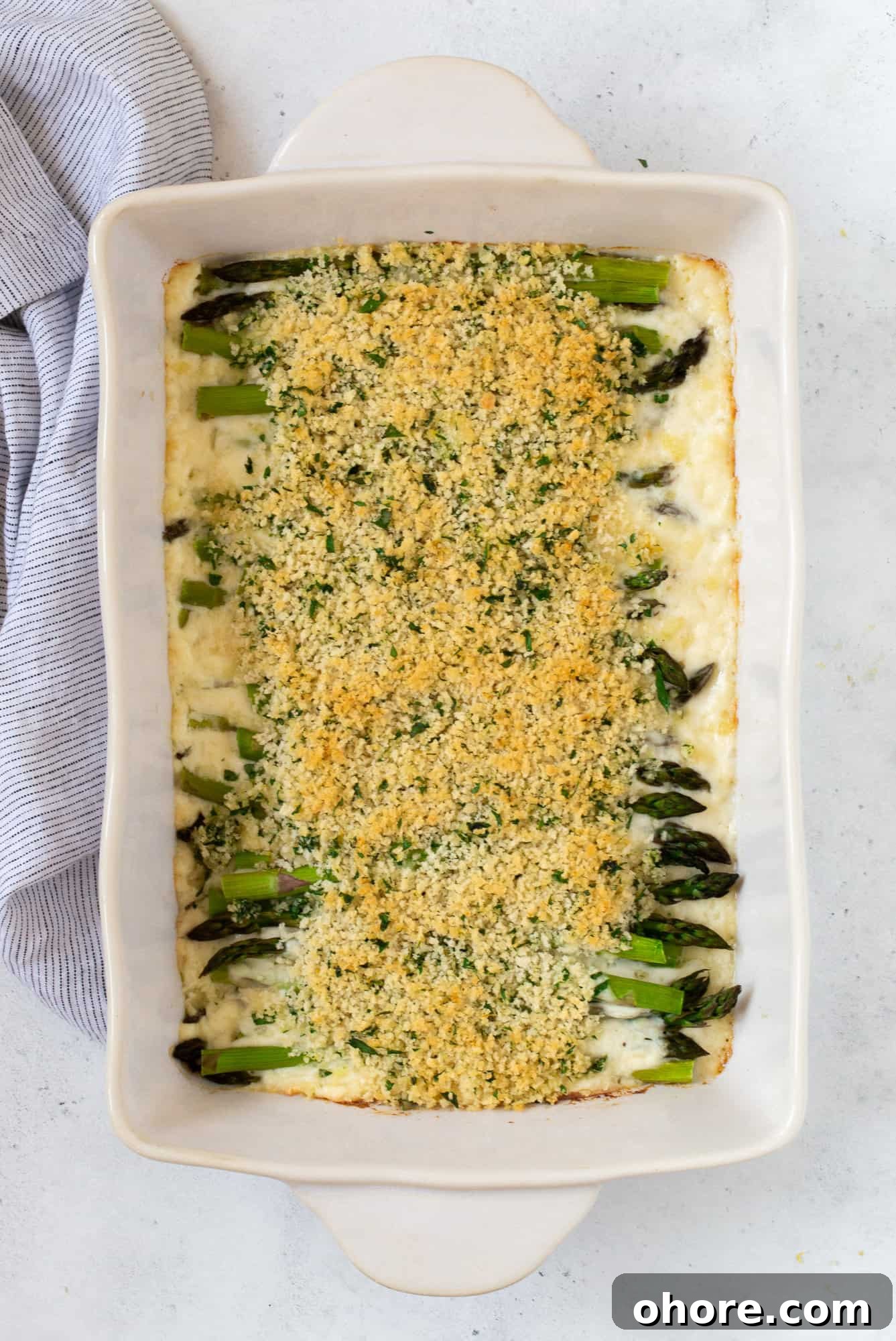 Creamy Asparagus Casserole Recipe for Spring Dinner 16 Finished asparagus casserole with toasted breadcrumbs on top.