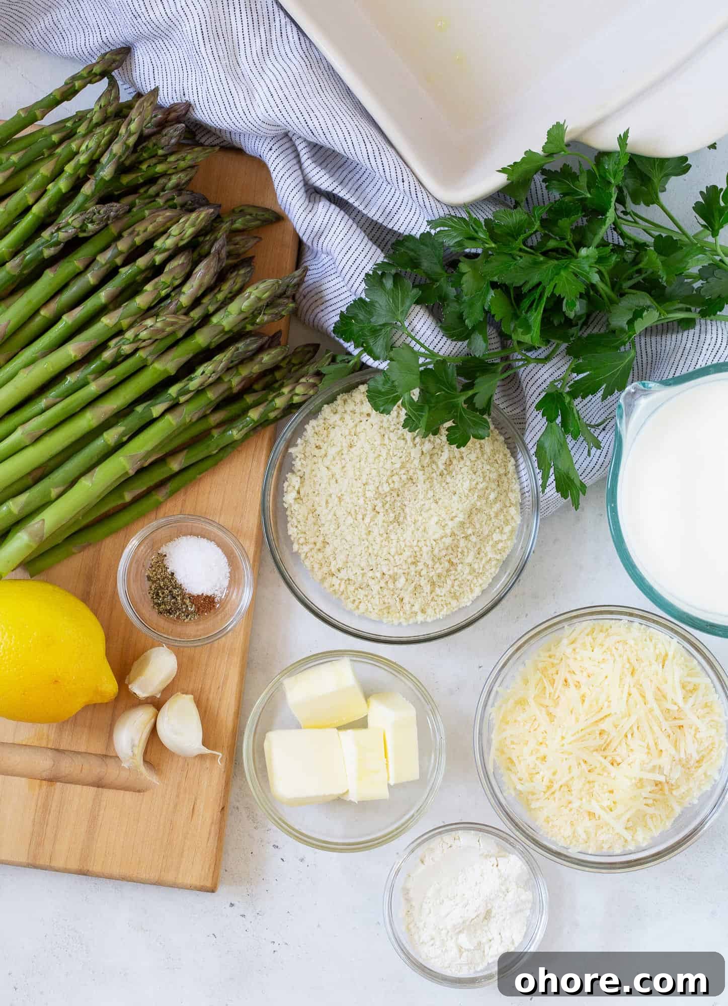 Creamy Asparagus Casserole Recipe for Spring Dinner 3 Overhead view of ingredients needed for recipe, including fresh asparagus.