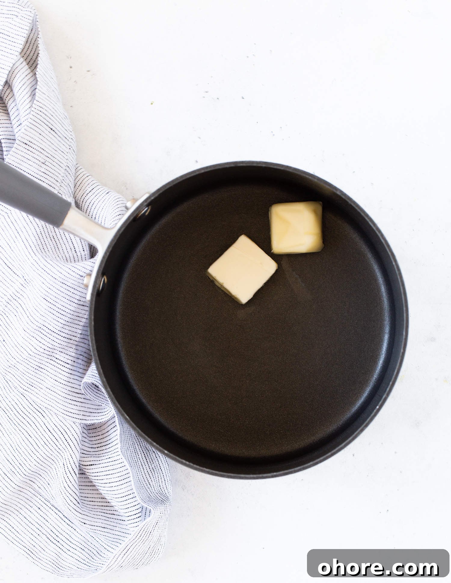 Creamy Asparagus Casserole Recipe for Spring Dinner 6 Unmelted butter in a black saucepan.
