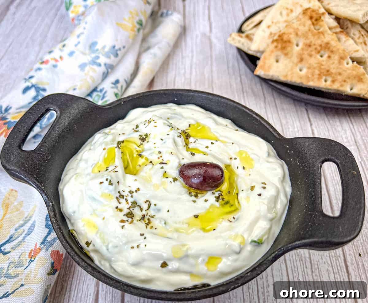 Tzatziki Sauce on a black bowl.