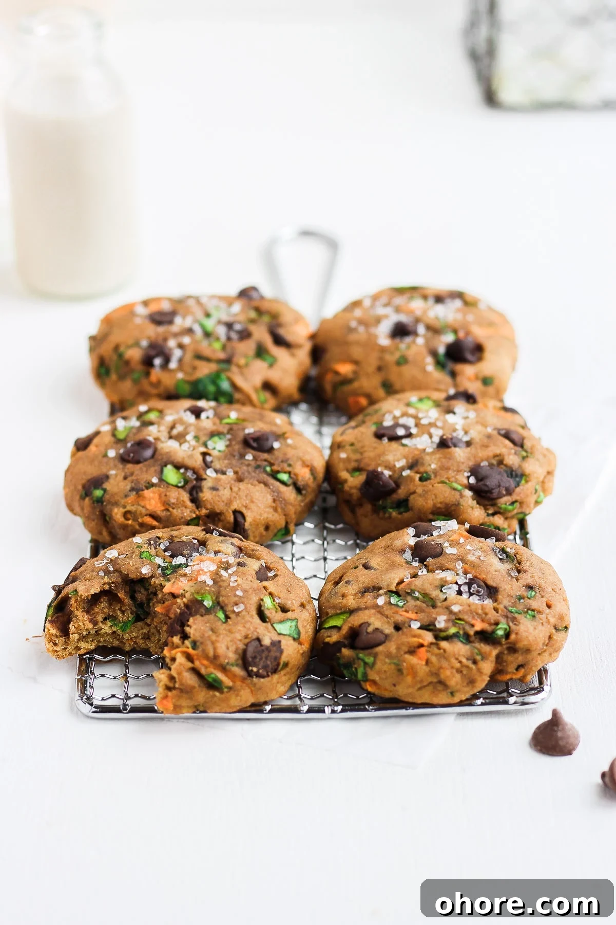 Wholesome Chocolate Chip Cookie Recipe That Melts in Your Mouth 3 Healthy Chocolate Chip Cookies on a cooling rack.