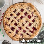 Homemade Raspberry Pie Recipe: Flaky Crust & Fresh Filling 13 Overhead shot of a pie dish with Raspberry Pie, waiting to be sliced.