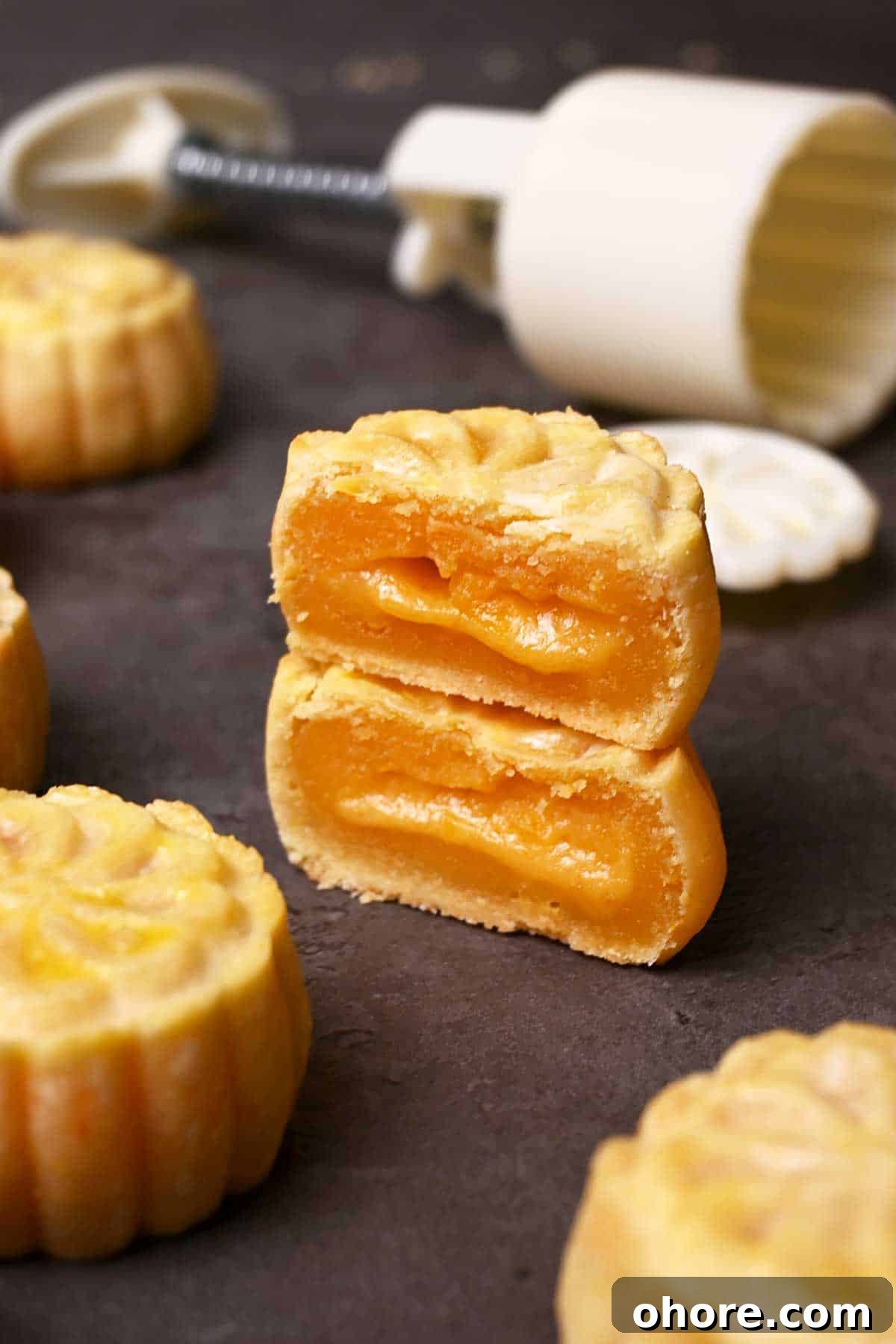 modern mooncakes with cookies crust, custard filling, and molten lava salted duck egg yolk filling