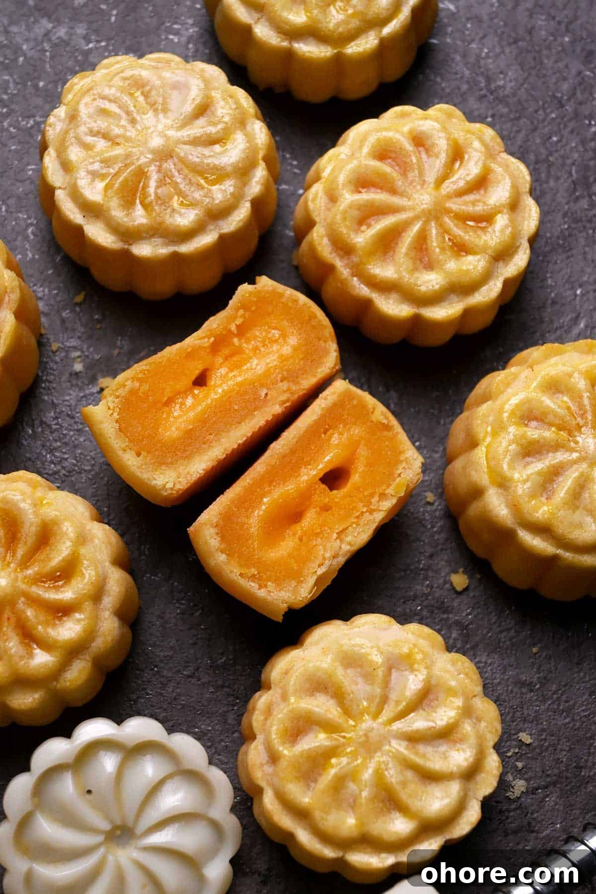 modern mooncakes with cookies crust, custard filling, and molten lava salted duck egg yolk filling