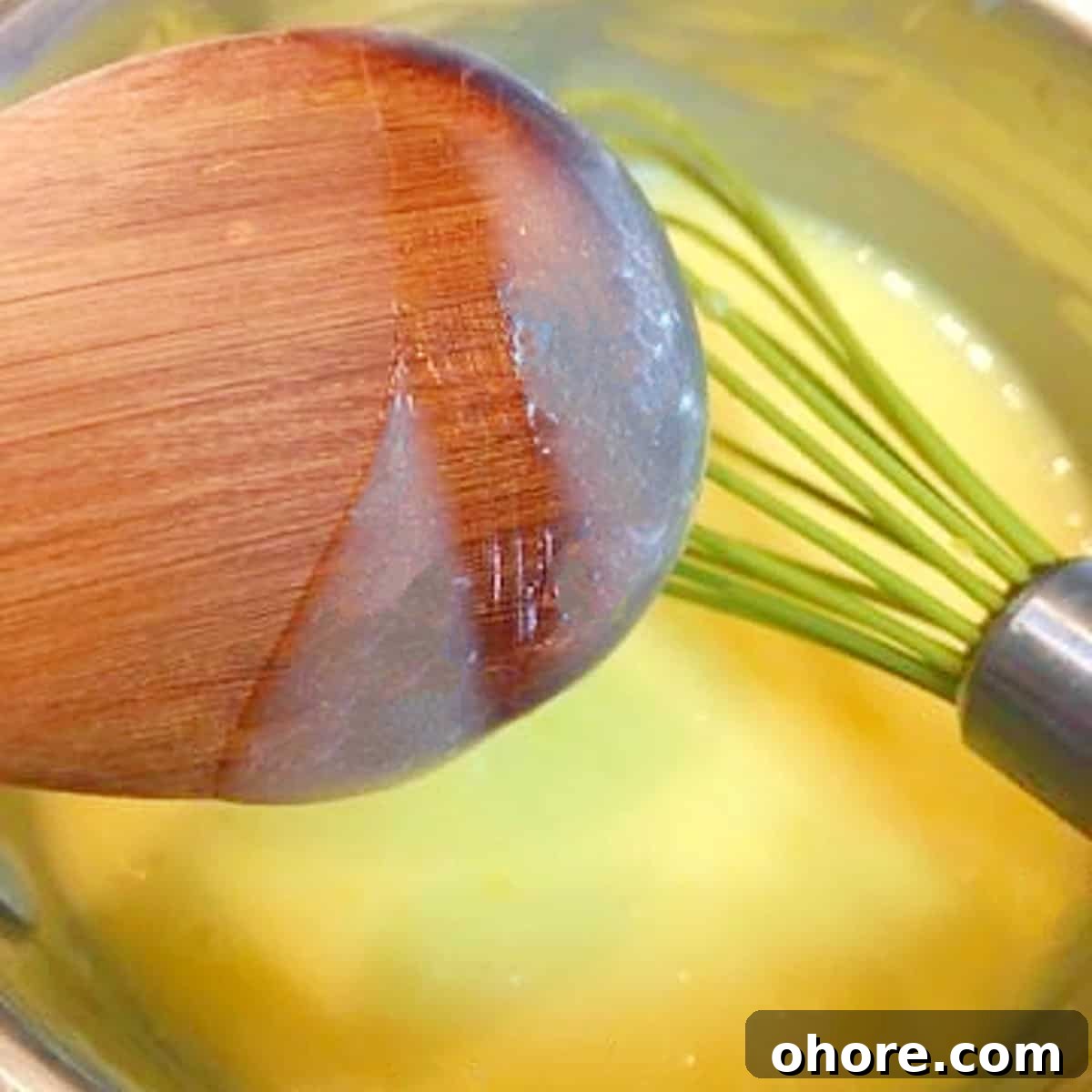 Homemade Meyer Lemon Curd Recipe — Bright Citrus Spread 5 lemon curd on back of wooden spoon.