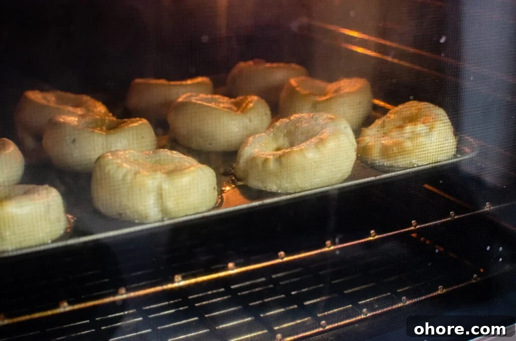 Oven Temperature Converter: °C to °F, Fan to Gas Mark Guide 3 yorkshire puddings cooking in a fan oven