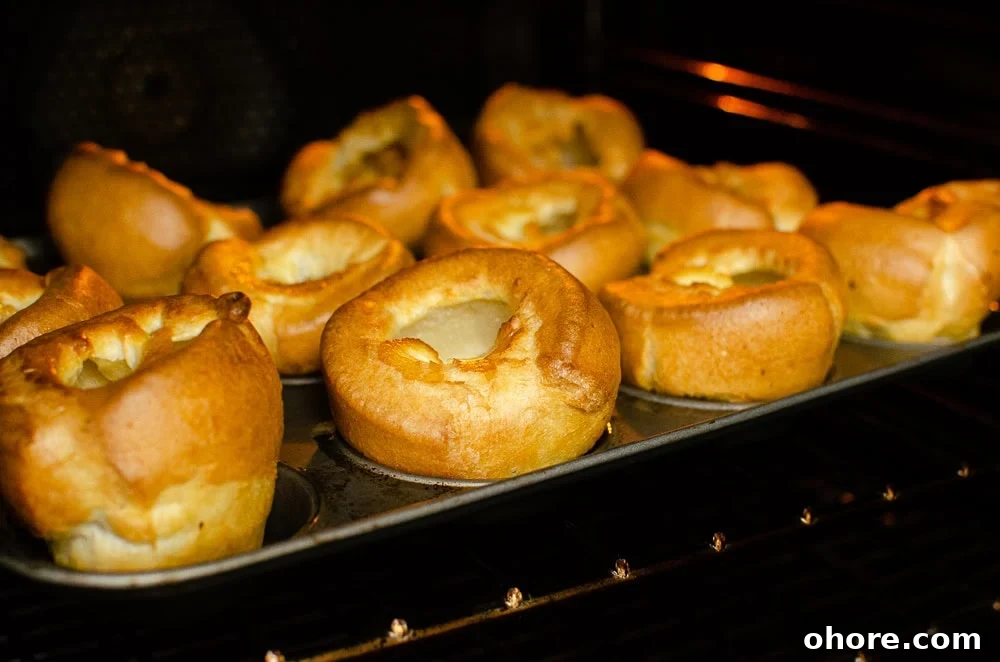 Oven Temperature Converter: °C to °F, Fan to Gas Mark Guide 4 Yorkshire puddings in a muffin tin on a fan oven shelf