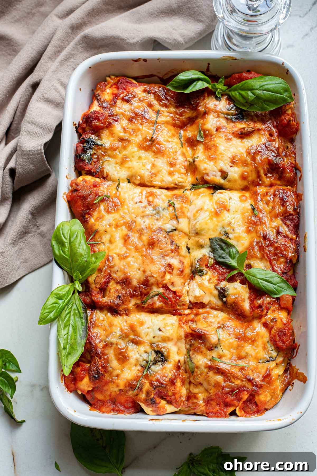 Festive Christmas Casserole Recipes for Holiday Gatherings 11 Top down view of the baked tortellini casserole cut into individual portions