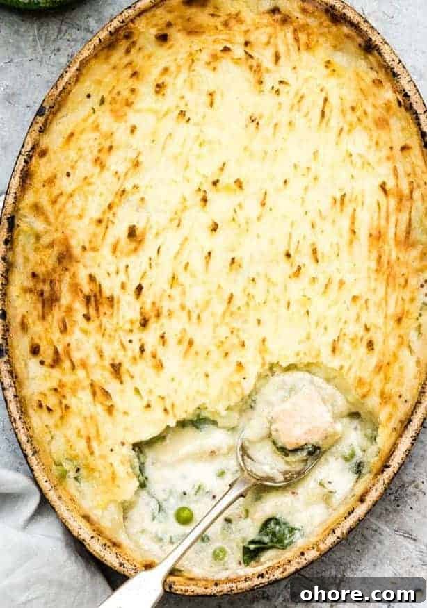 Festive Christmas Casserole Recipes for Holiday Gatherings 8 Gluten free fish casserole with a serving spoon