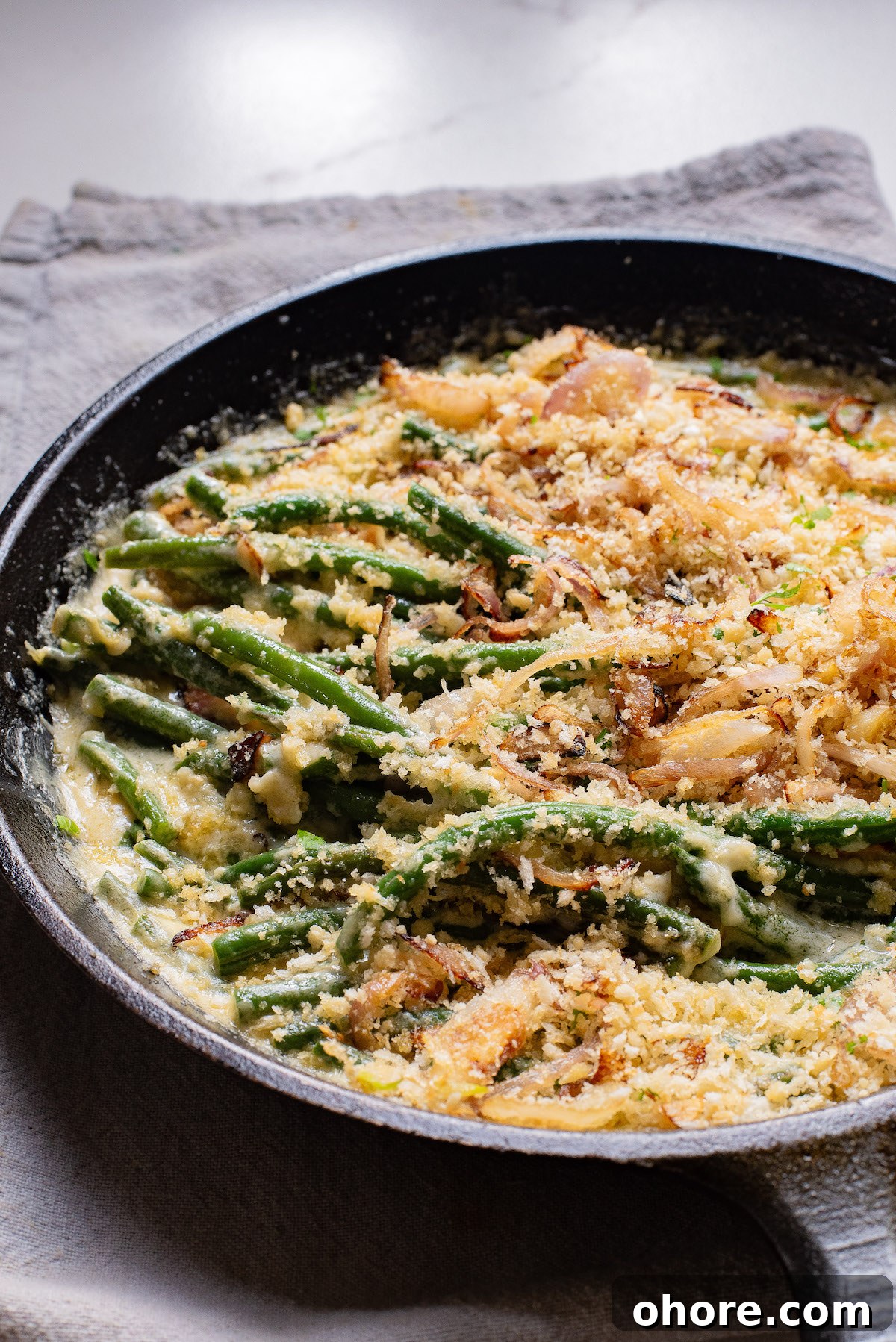 Festive Christmas Casserole Recipes for Holiday Gatherings 9 The finished green bean casserole recipe in a skillet