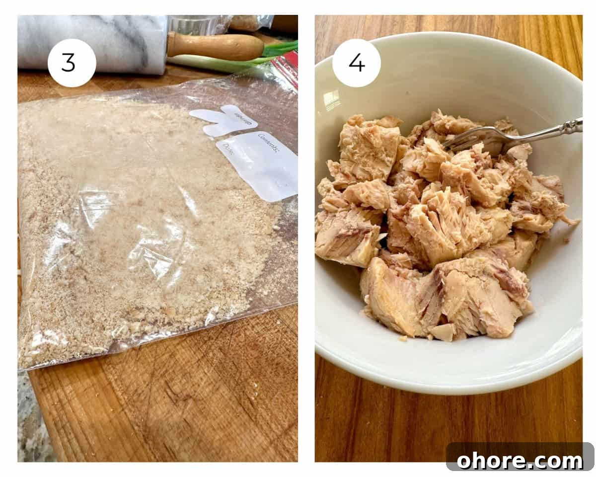 Crackers and flaked salmon in a bowl.