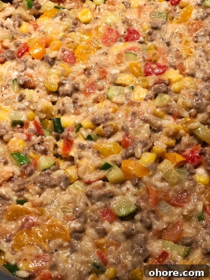 The BEST easy stuffed bell peppers recipe, ever! Using ground beef (or ground turkey), cheese, zucchini, corn, tomatoes and rice! Bake them in the oven, and enjoy this easy and healthy dinner recipe for the family. Instrupix.com