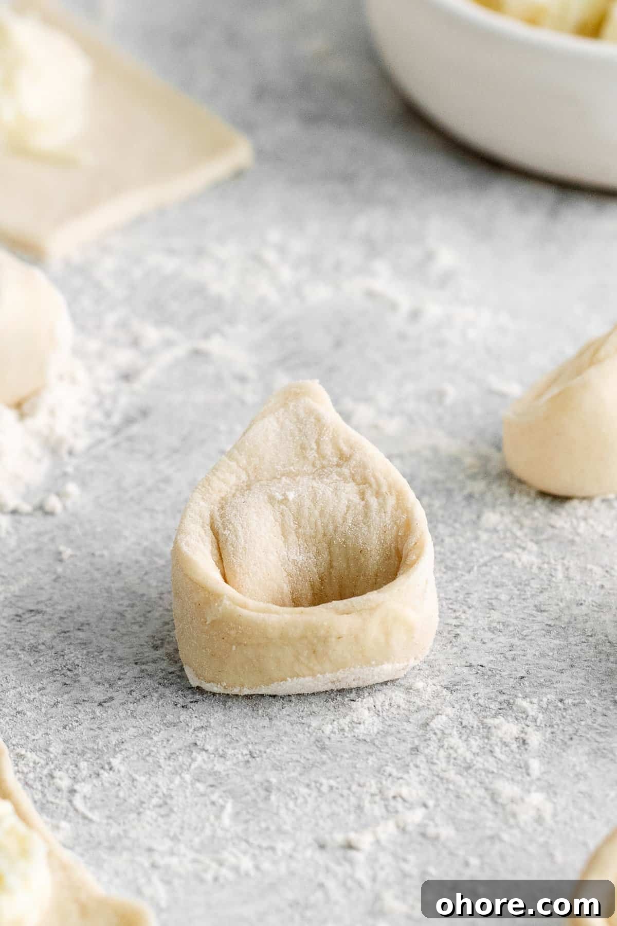 tortellini on cutting board.