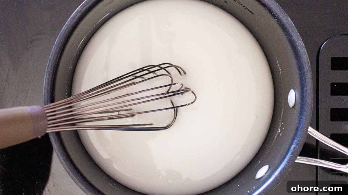 Water, sugar, and corn starch combined in a saucepan.