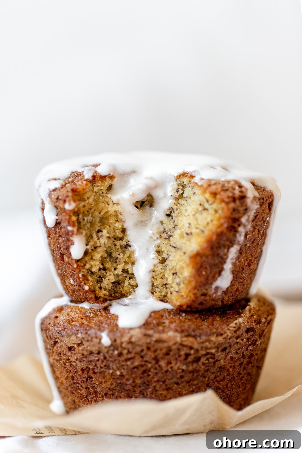 Spiced Rum Banana Muffins with a Boozy Twist 5 banana bread muffins with a glaze on top