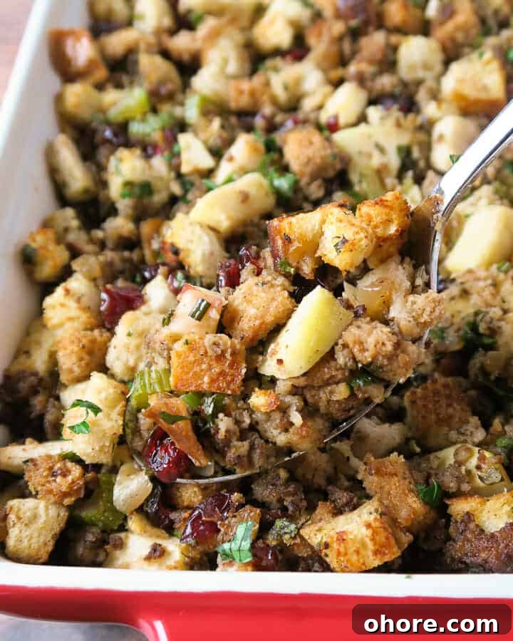 close up shot of sausage stuffing with apples, cranberries, and herbs