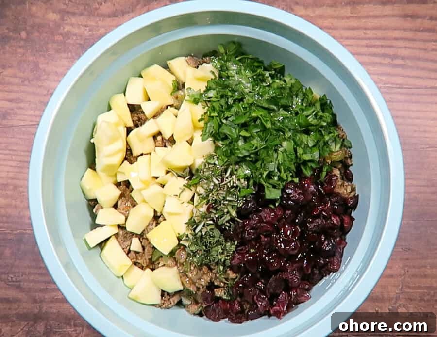 ingredients all in a bowl for the sausage stuffing 