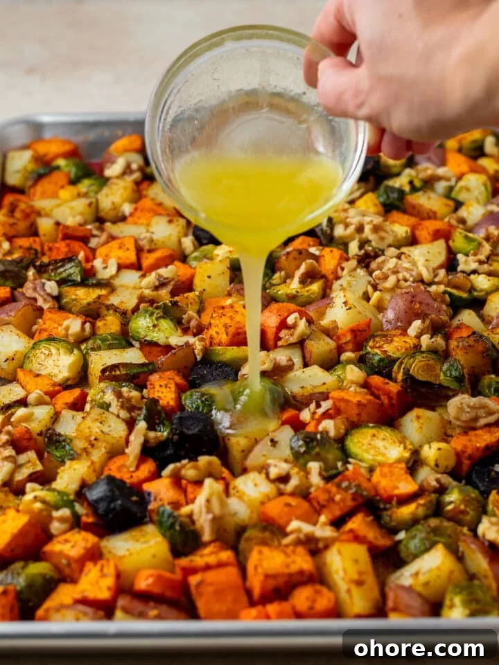 Honey-Roasted Vegetables with Miso Glaze and Crunchy Walnuts 7 hand pouring a honey butter glaze on roasted vegetables