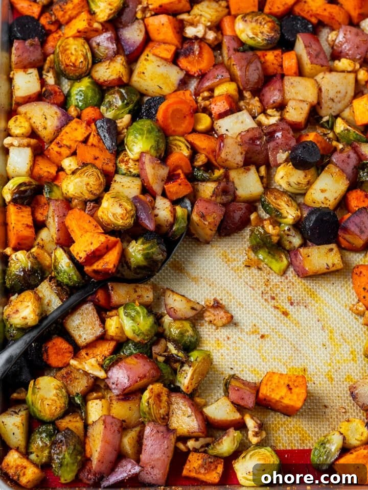 Honey-Roasted Vegetables with Miso Glaze and Crunchy Walnuts 8 spoon scooping up roasted honey walnut vegetables