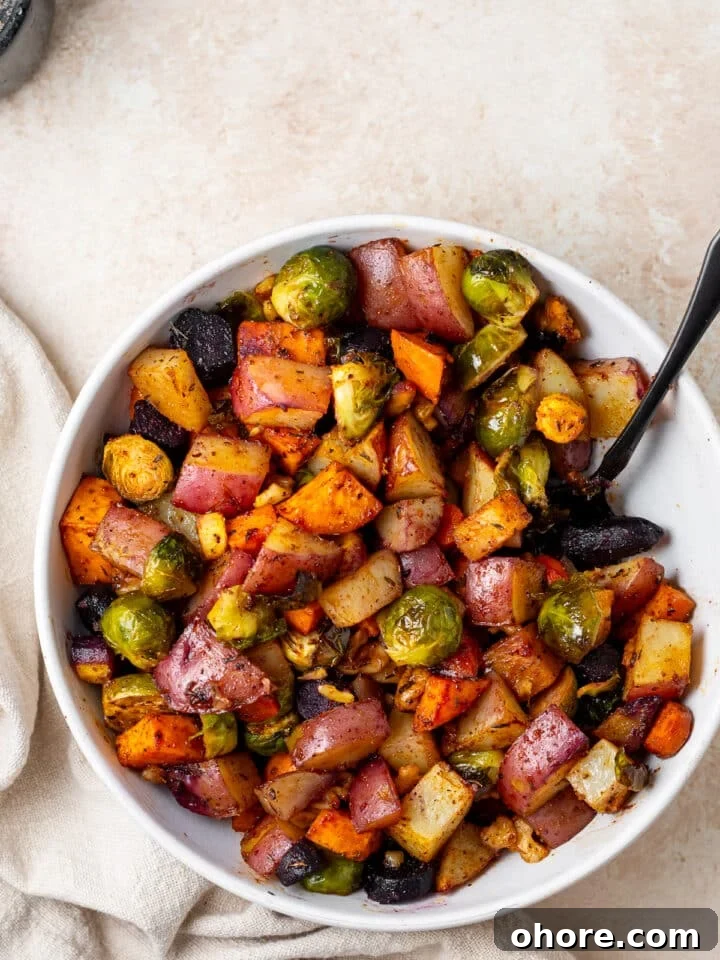 Honey-Roasted Vegetables with Miso Glaze and Crunchy Walnuts 10 white serving bowl with honey roasted sweet potatoes, red potatoes, brussels sprouts and carrots