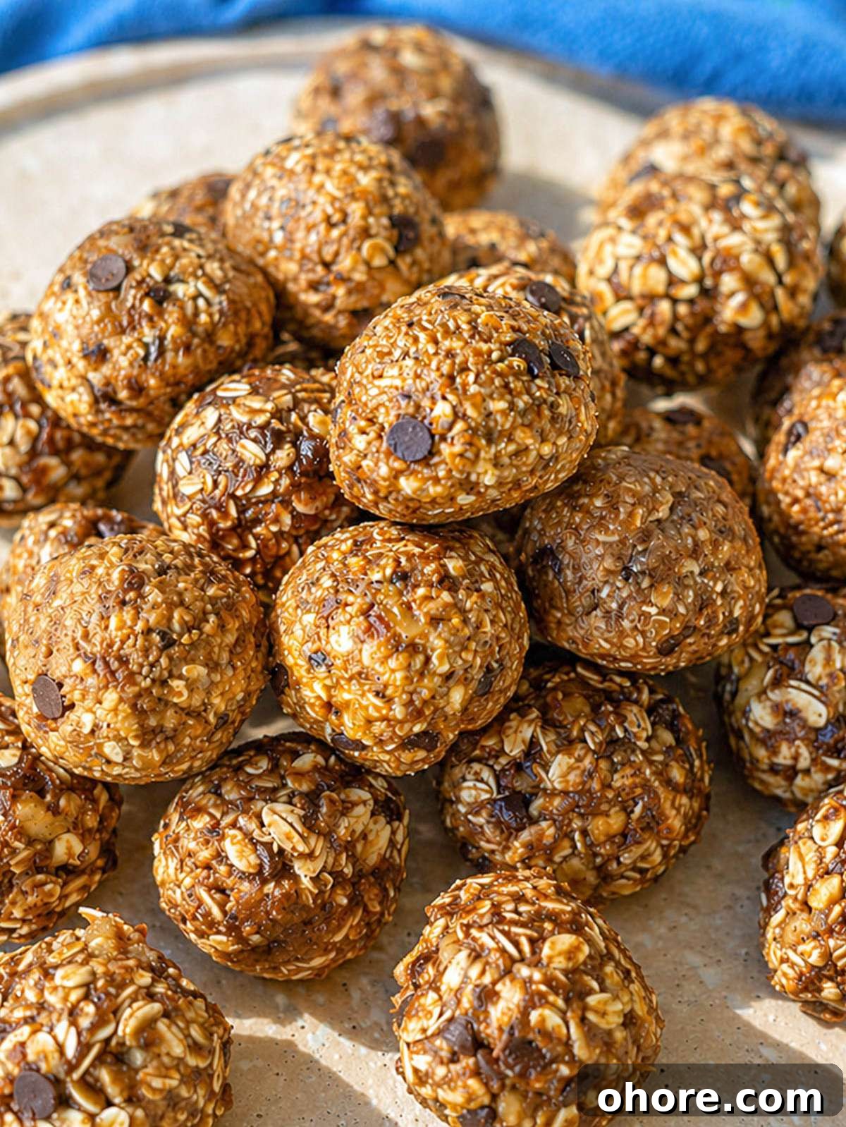 No-Bake Banana Bread Energy Balls — One-Bowl, No Blender Recipe 4 Plate of banana bread energy balls on marble table, soft light from window.