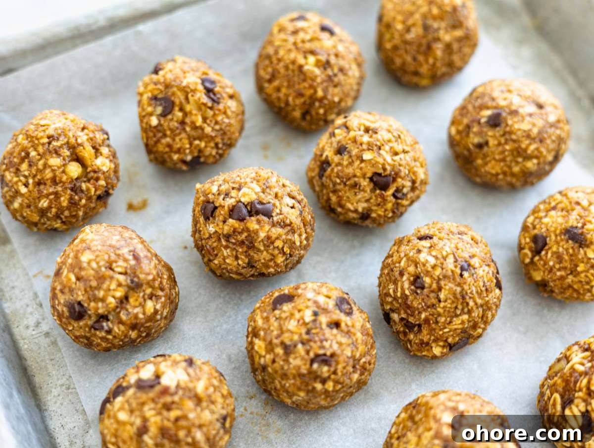 No-Bake Banana Bread Energy Balls — One-Bowl, No Blender Recipe 7 Step 3 Energy balls resting on a plate before chilling, soft natural light.