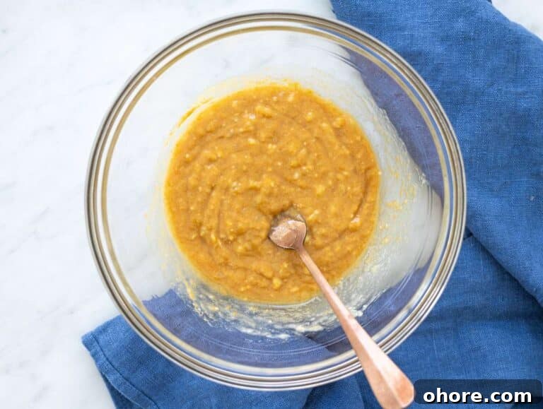 No-Bake Banana Bread Energy Balls — One-Bowl, No Blender Recipe 10 Step 1 Peanut butter, honey, and banana mixed into a smooth creamy base.