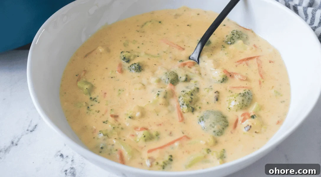 Broccoli Cheddar Soup in bowl with spoon