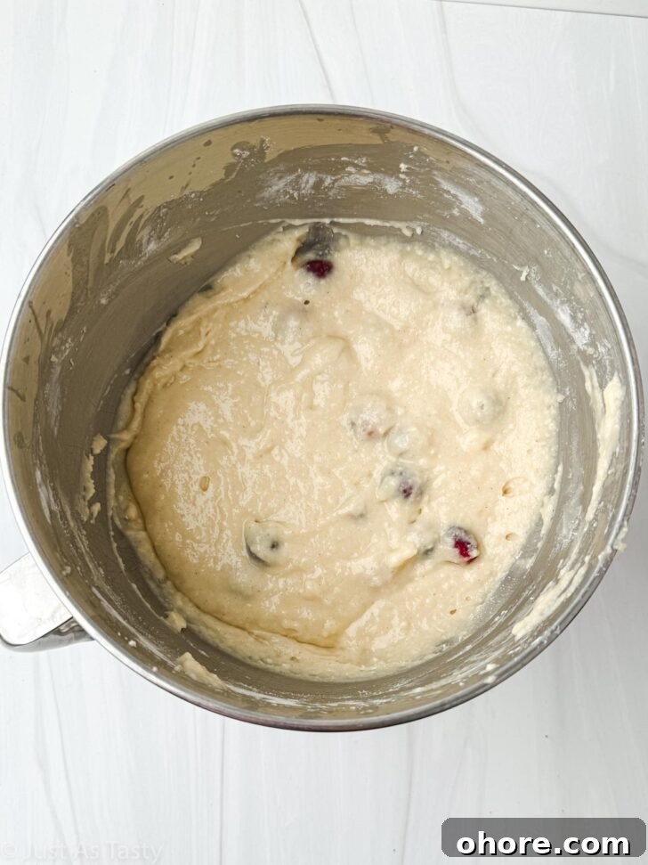 Cranberry Orange Bundt Cake with Zesty Citrus Glaze 5 Cranberry orange bundt cake batter in a bowl.