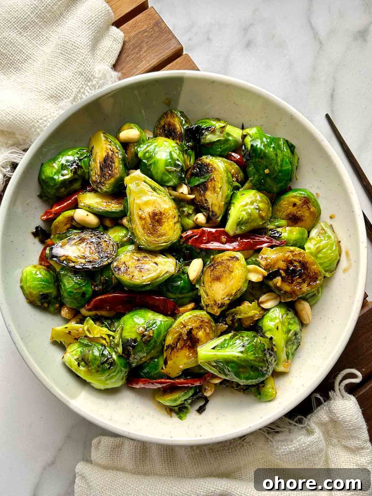 PF Chang's-Style Kung Pao Brussels Sprouts Recipe 2 overhead shot of Kung Pao Brussels sprouts on plate.