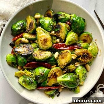 PF Chang's-Style Kung Pao Brussels Sprouts Recipe 12 overhead shot of Kung Pao Brussels sprouts on plate.