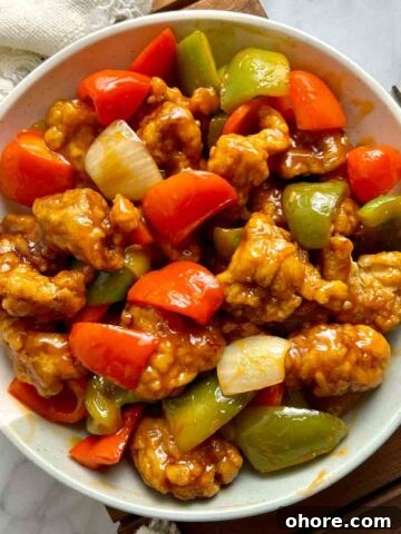 overhead view of sweet and sour pork on plate.