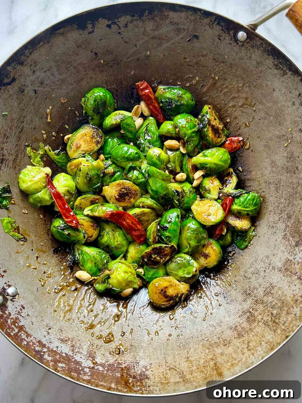 PF Chang's-Style Kung Pao Brussels Sprouts Recipe 10 all ingredients stir-fried together in wok.