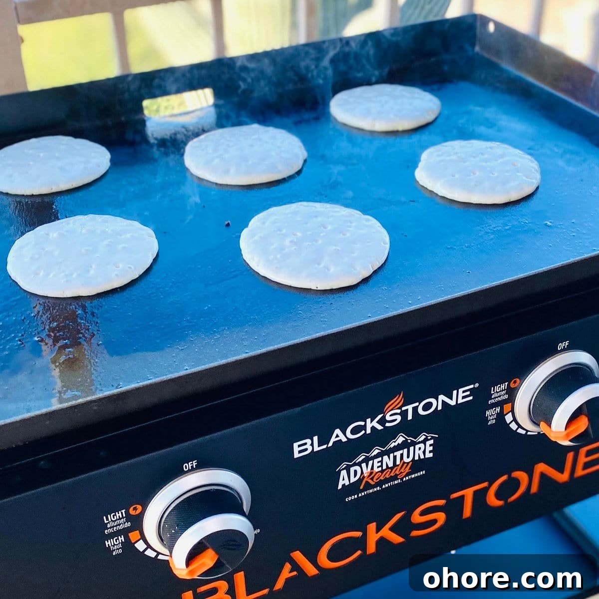 Fluffy Pancakes on a Blackstone Griddle: Perfect Morning Stack 3 blackstone pancakes on griddle.