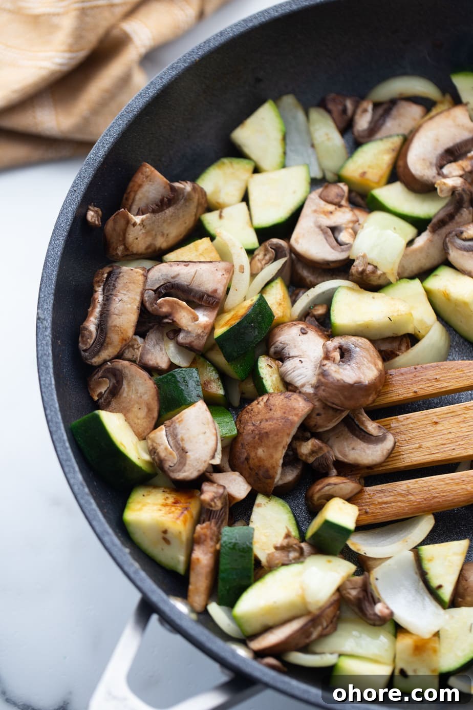 Hibachi Chicken Recipe: Tender Grilled Chicken with Garlic Butter 7 Fresh vegetables are being cooked in a skillet.