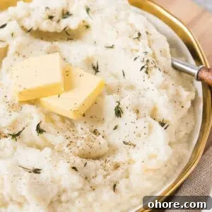 Creamy Garlic Mashed Cauliflower Recipe for Low-Carb Meals 8 cauliflower mashed potatoes in a bowl