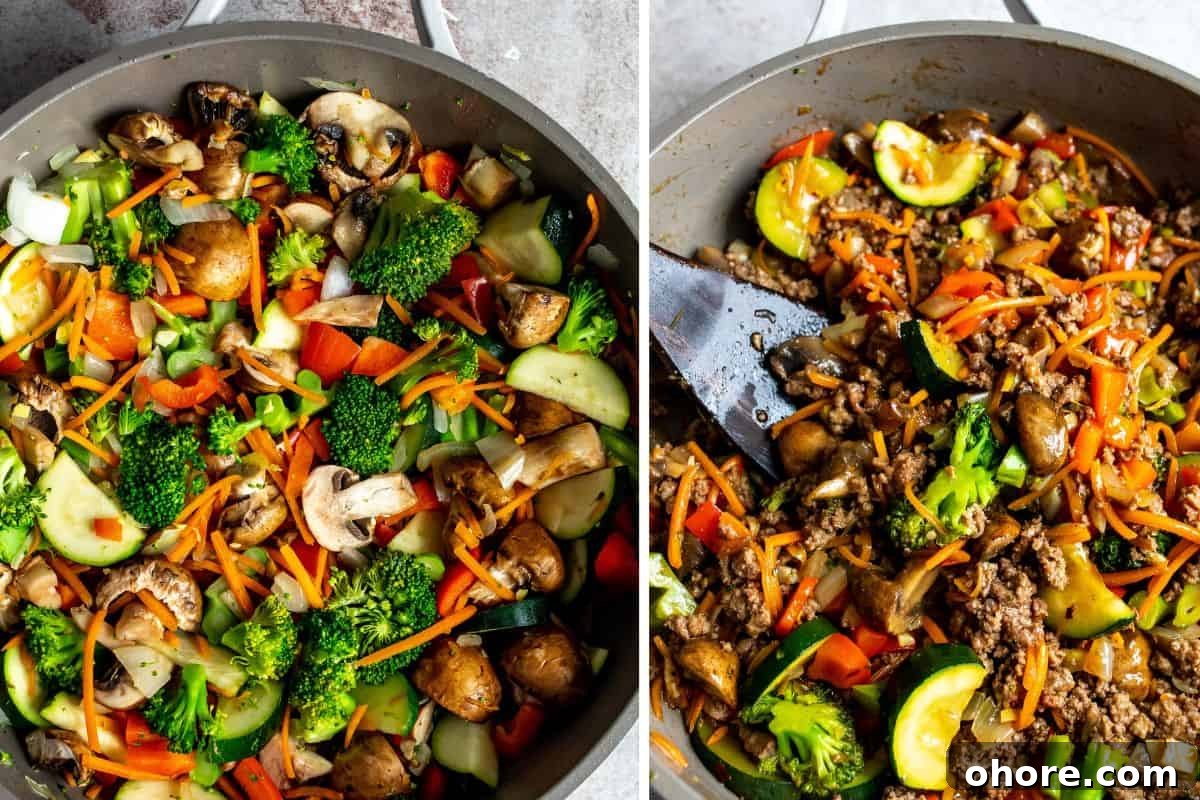 Quick Garlic Ground Beef Stir-Fry Recipe for Weeknight Dinners 5 Grey skillet with veggies and beef in it, with a wooden spatula.