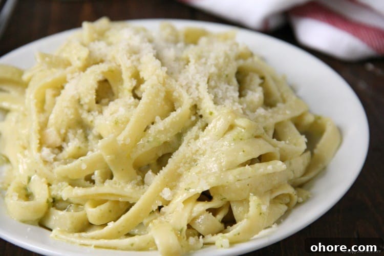 Simple Pesto Alfredo, easy dinner recipe with fettuccine and pesto alfredo sauce from scratch Pesto Alfredo with homemade alfredo sauce in bowl