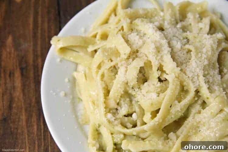 Tasty Pesto Alfredo, easy dinner recipe with fettuccine and homemade pesto alfredo sauce Pesto Alfredo with basil pesto in bowl