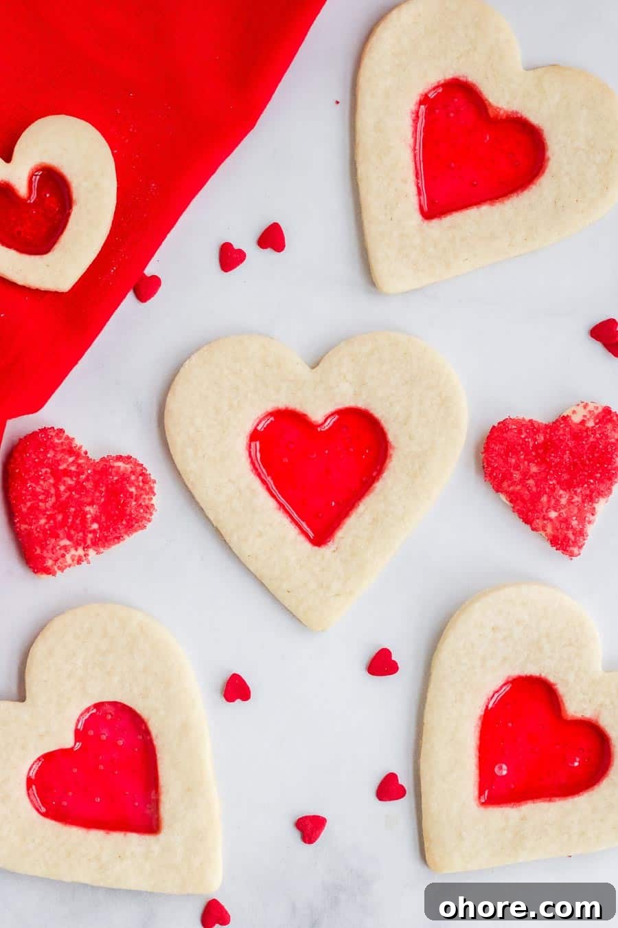 Stained Glass Cookies: Recipe and Decorating Tips 2 Heart shaped stained glass cookies with red centers