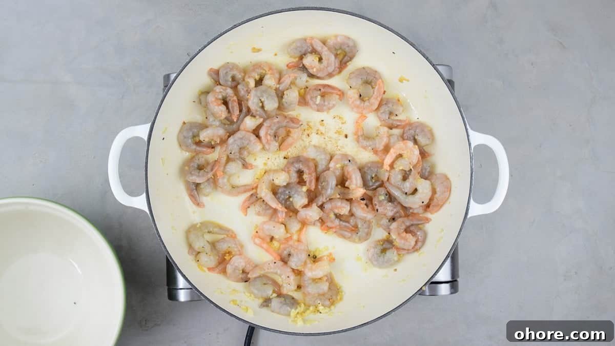 Cook garlic and shrimp