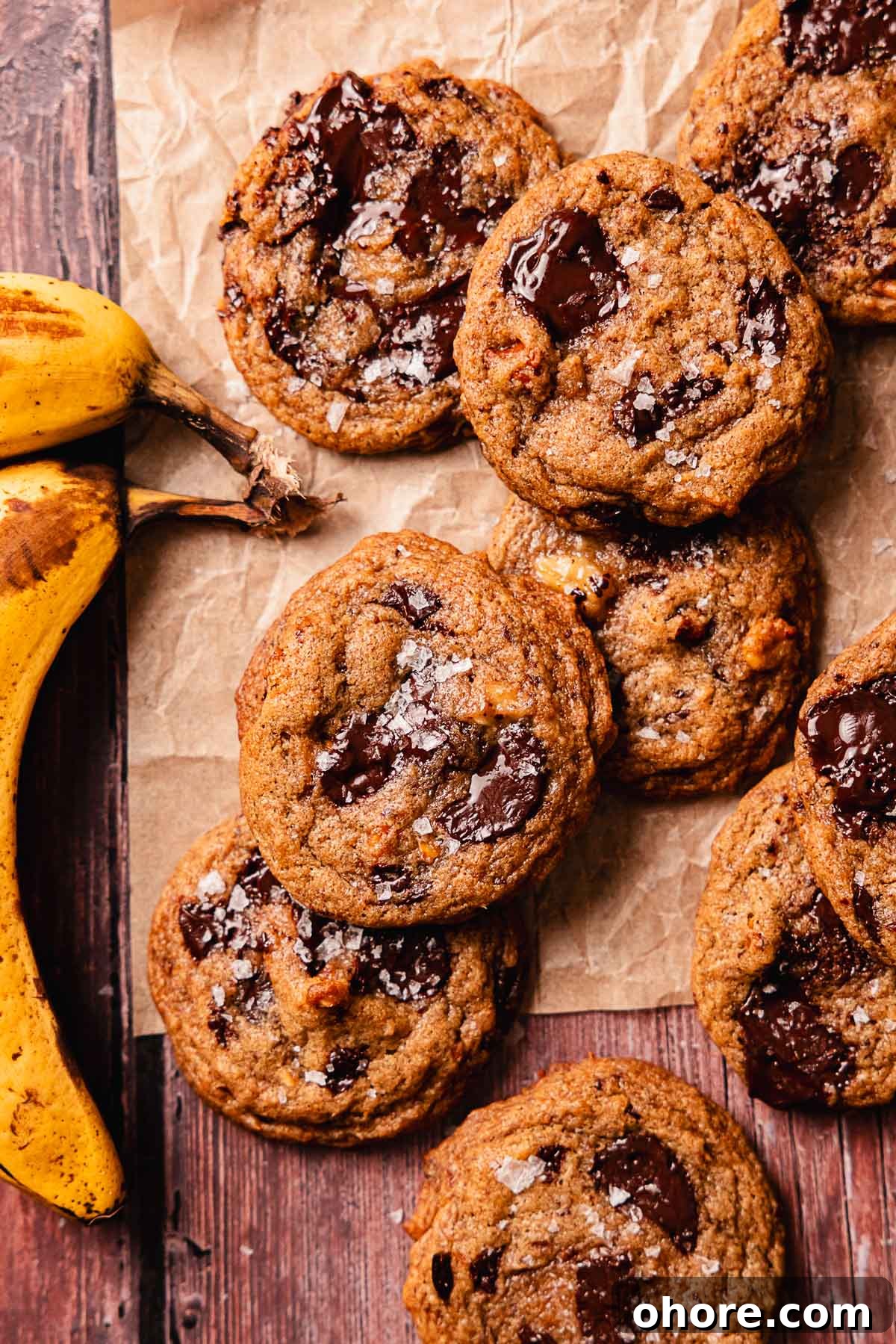 banana bread cookies with flaky salt on parchment paper